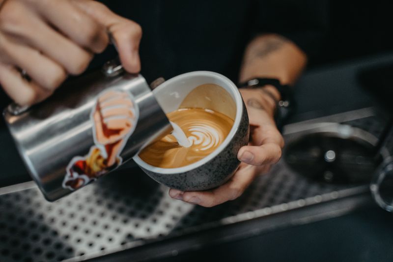 Pouring a coffee with care